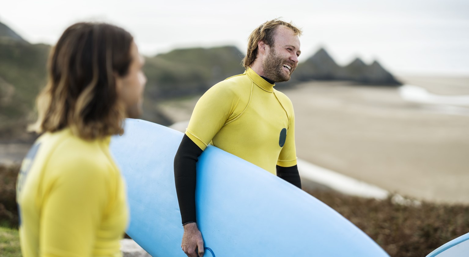 Two surfers on the beach