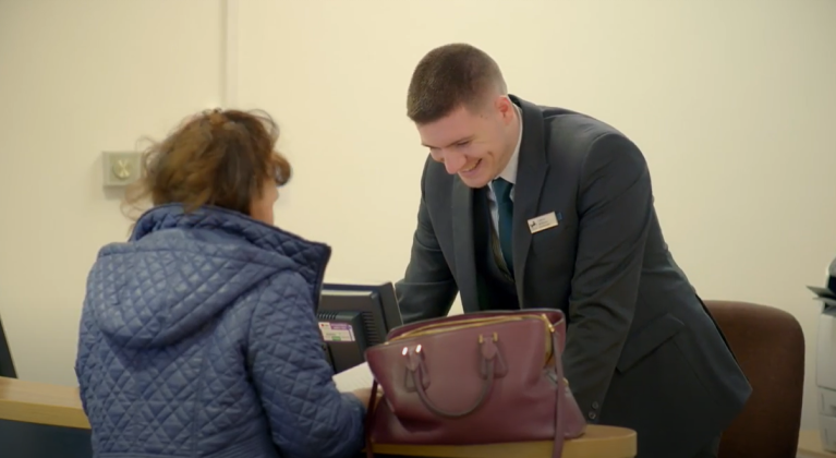 Lloyds Bank colleague helping a customer