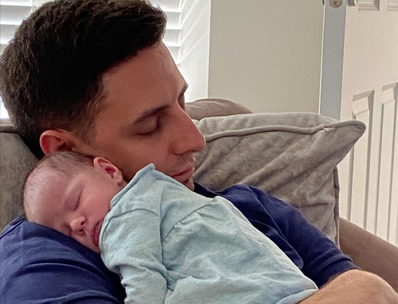 Josh cuddling his baby