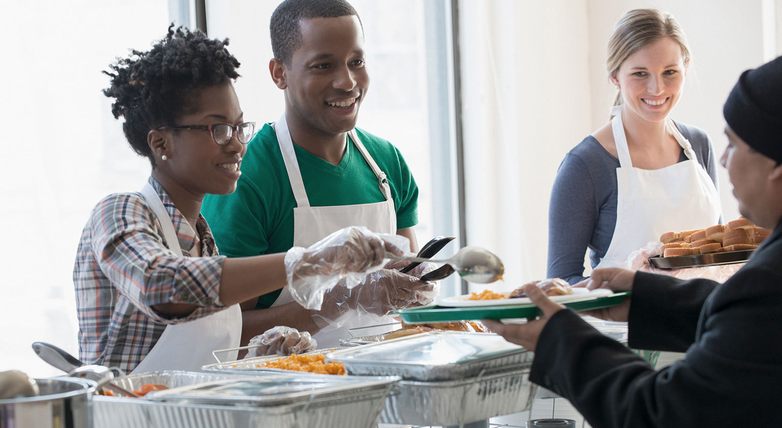 Volunteers handing out food the the community