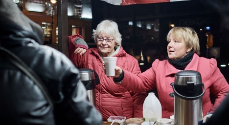 Volunteers handing out hot drinks in winter