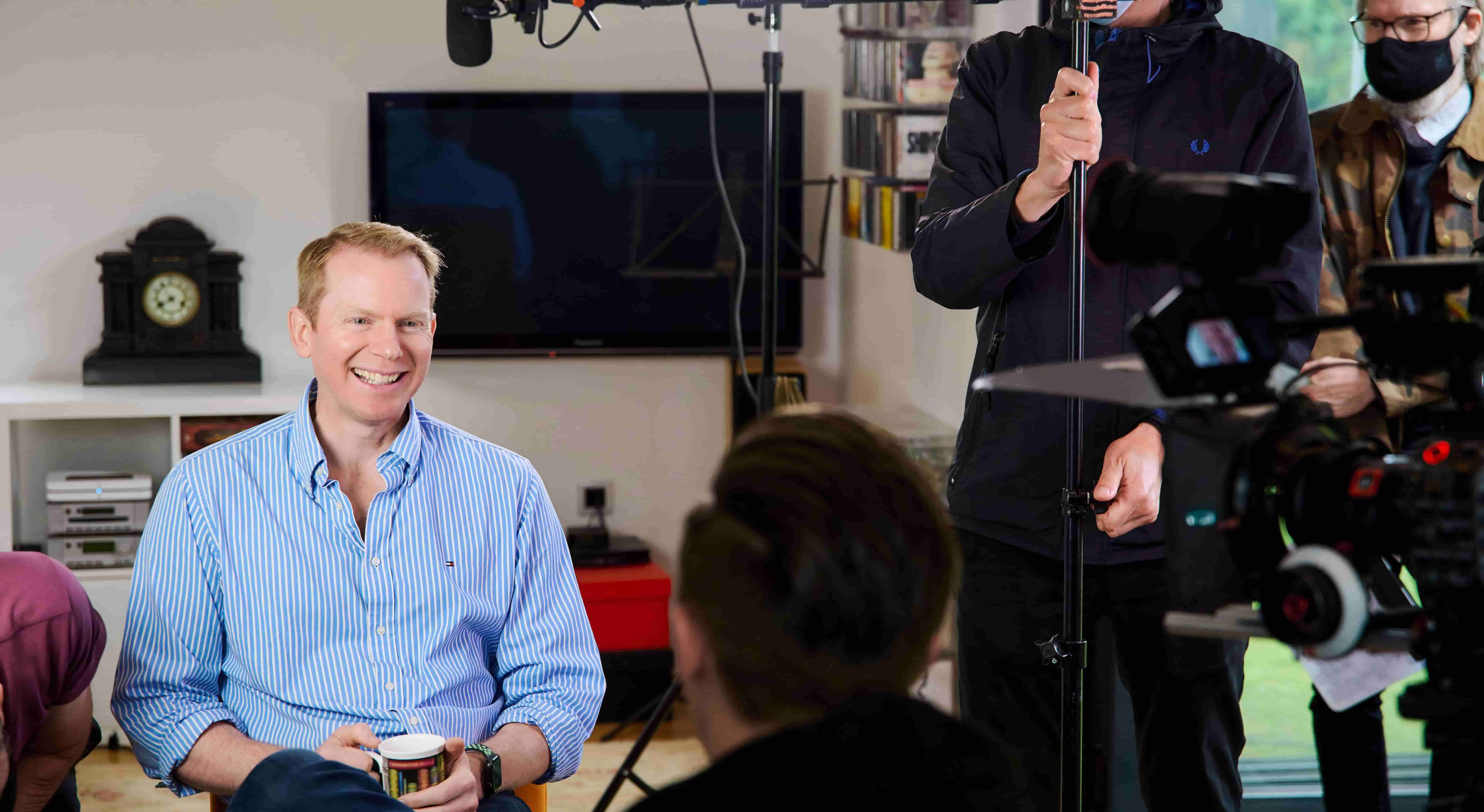 Photo of Charlie Nunn smiling in front of camera crew