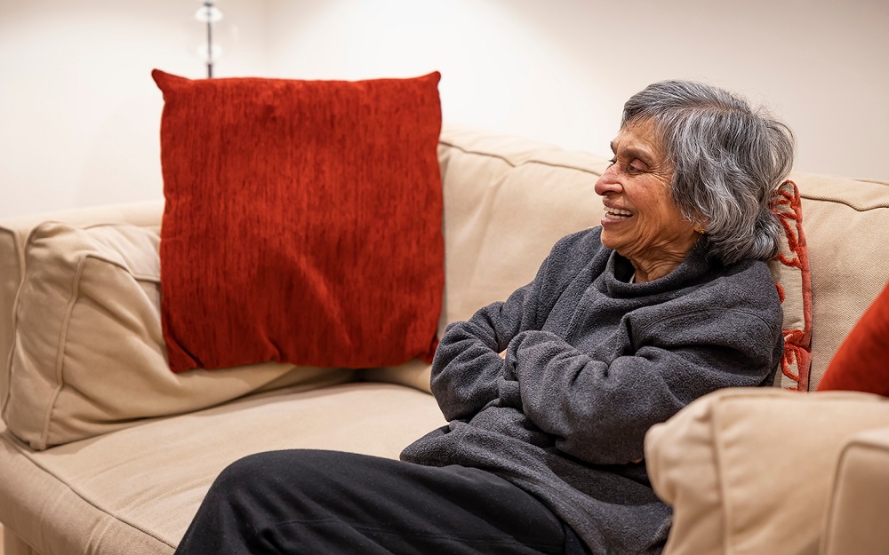 An old lady sat down and smiling