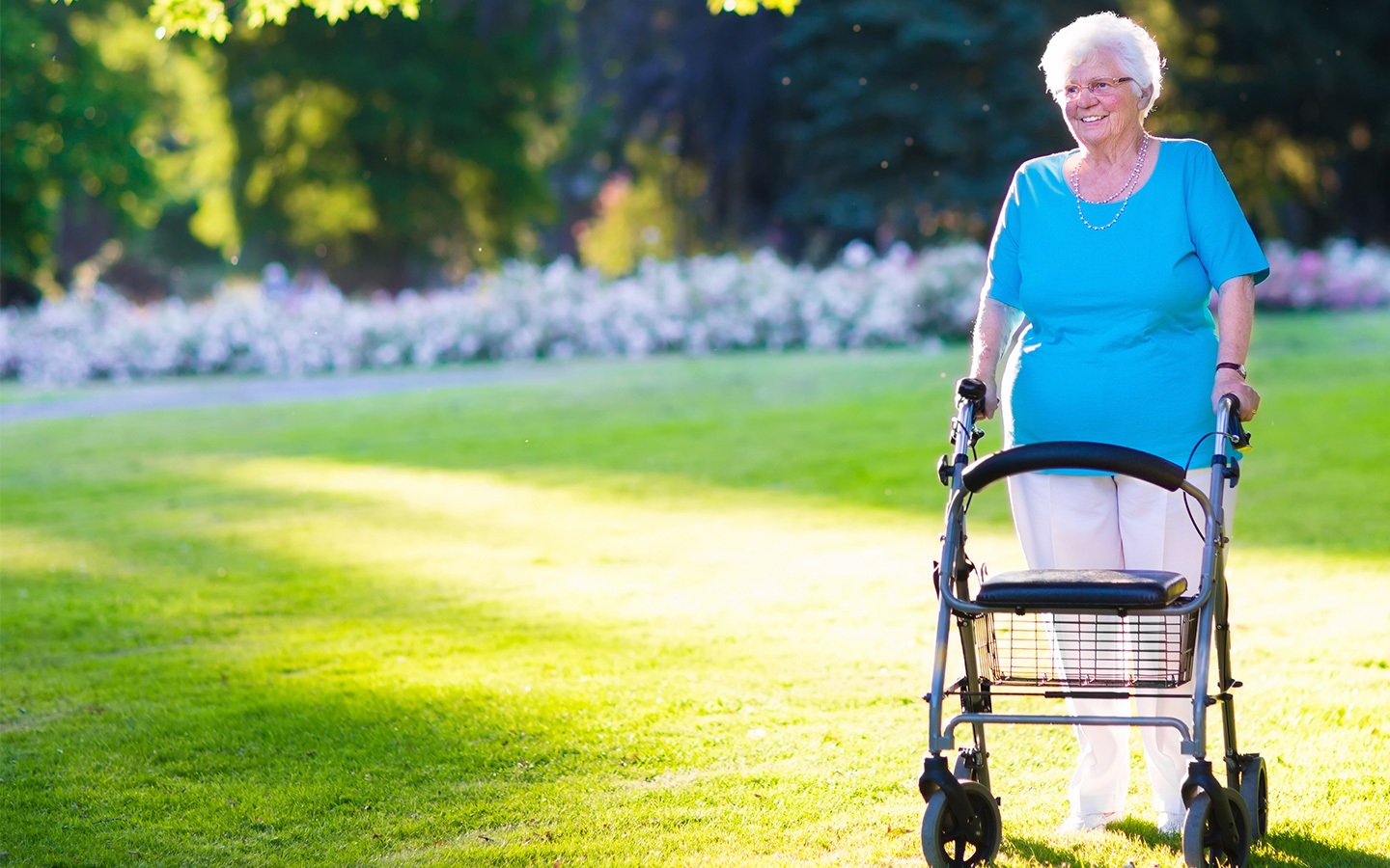 An old lady walking with a zimmerframe
