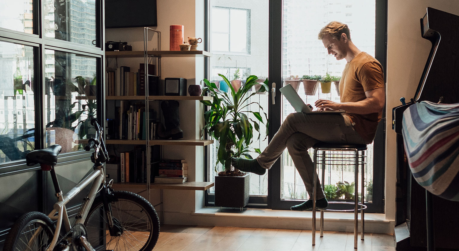 Man sat working at a laptop