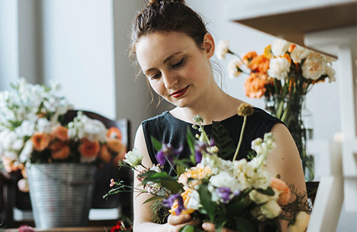 Woman arranging flowers 