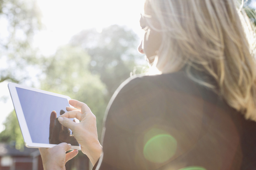A woman using a tablet device