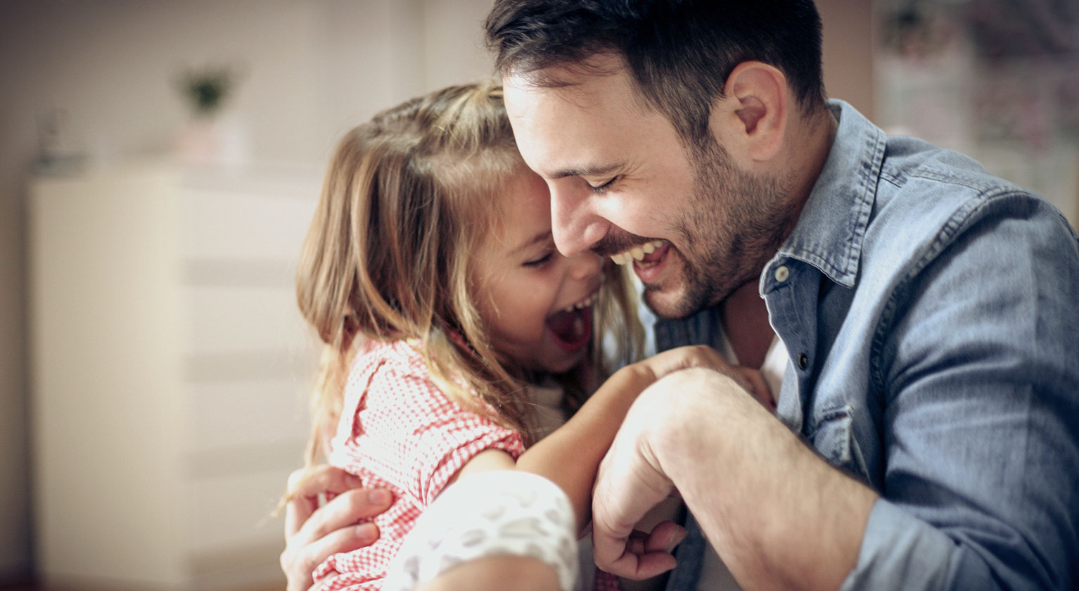 Father and daughter embracing each other