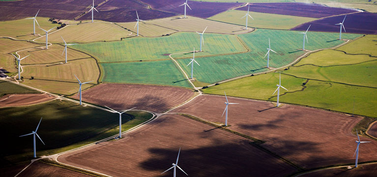 Drone view of wind turbines in fields