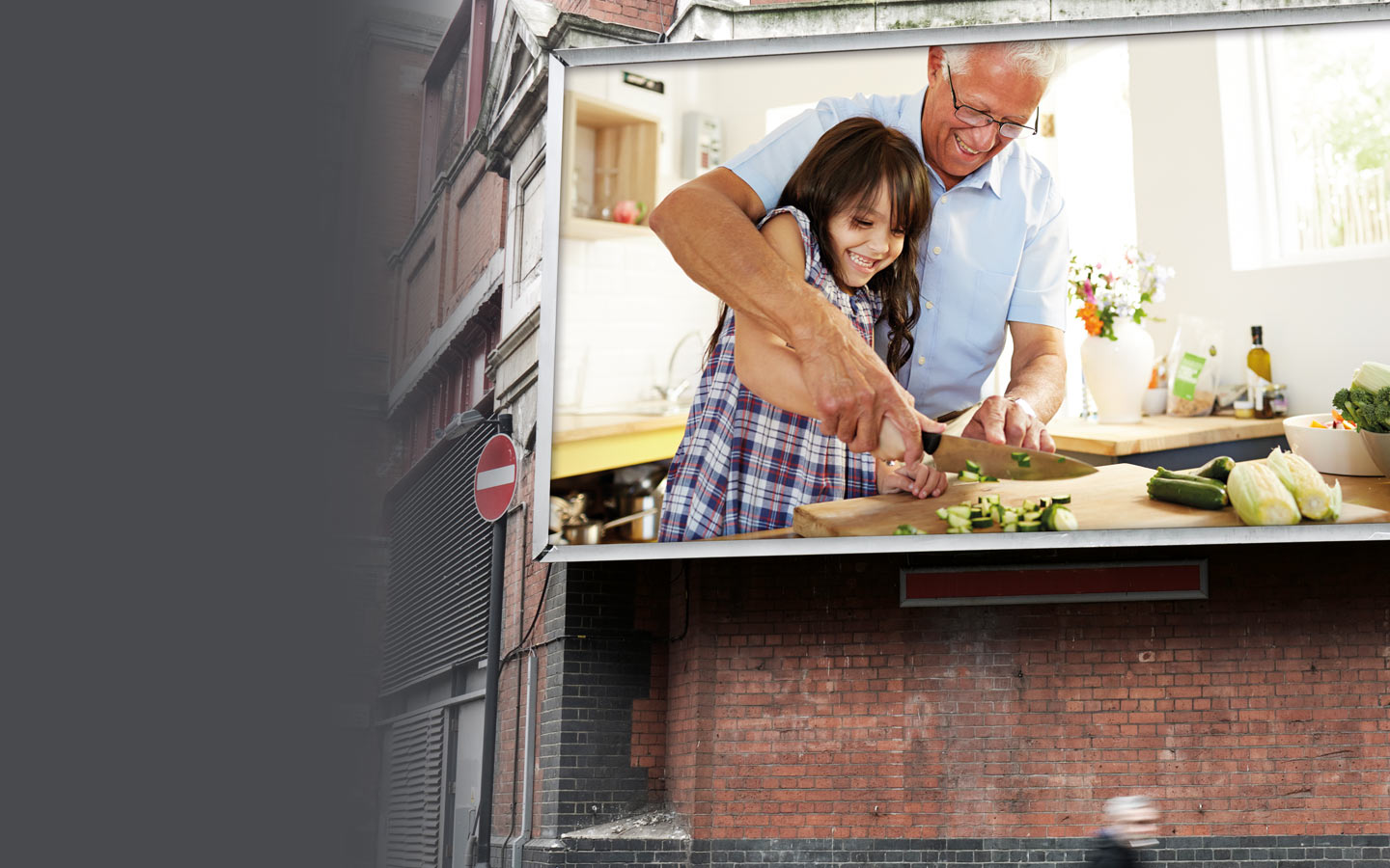 Grandfather and granddaughter cooking together