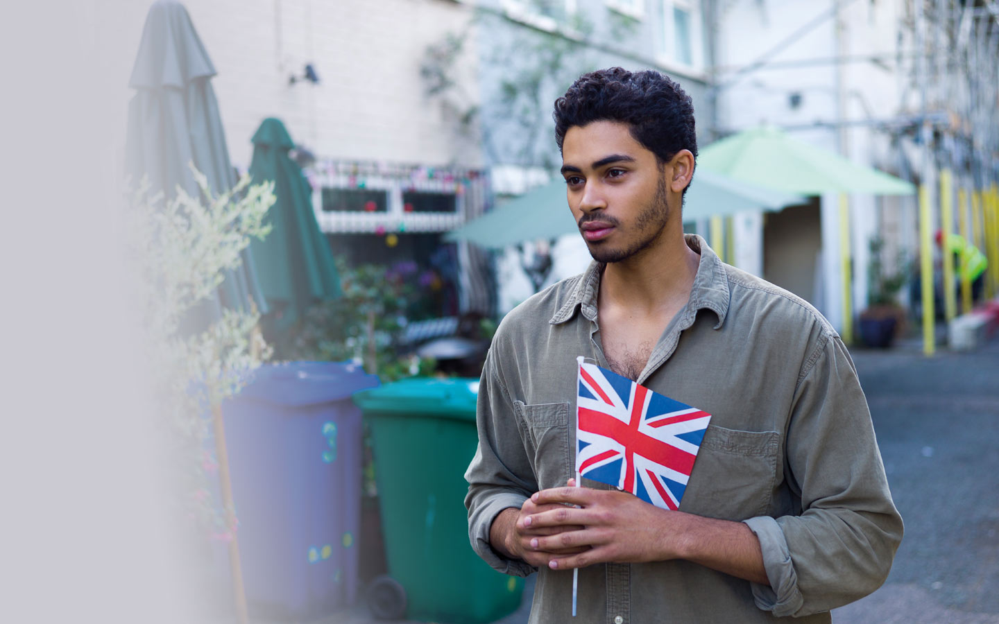 Man standing holding Union Jack flag
