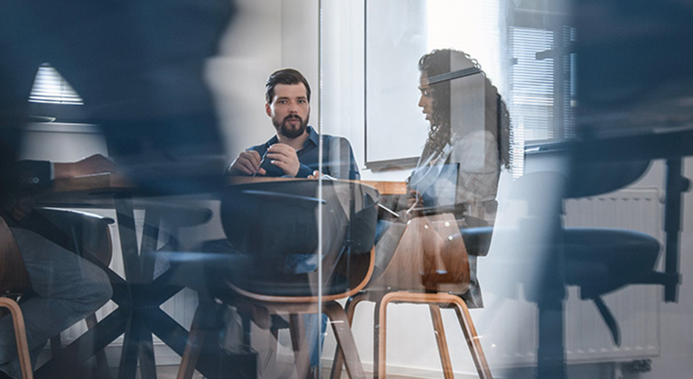 Man and woman working in an office